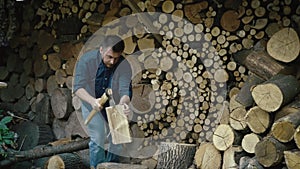 Winter warmth prep: guy laboring to gather firewood for farmhouse fireplace