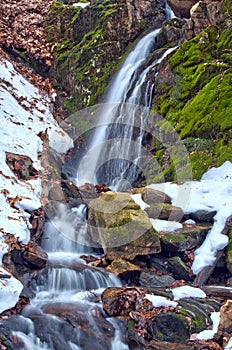 Winter Waterfall and Melting Snow