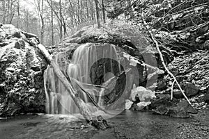 Winter waterfall after snowfall