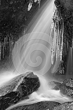 Winter waterfall thaw and icicles