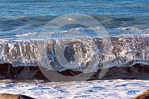 Winter waves running ashore