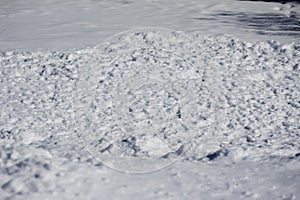 Winter weather landscape of a snow bank of freshly shoveled snow