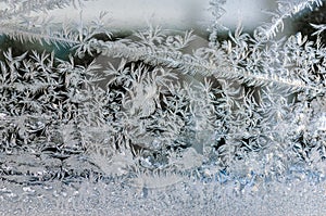 winter window ice crystal pattern on blue