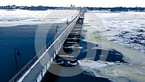 Winter Wisconsin trail bridge over lake