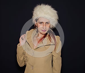 Winter Woman with coat and ushanka photo