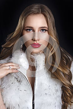Winter Woman in Luxury Fur Coat. Beauty Fashion Model Girl in Bl