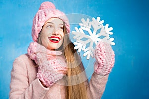Winter woman portrait on the blue background