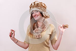 Winter woman in warm clothing fur cap