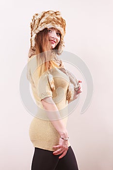 Winter woman in warm clothing fur cap