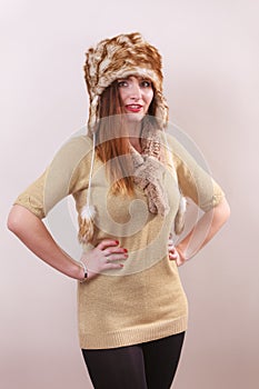 Winter woman in warm clothing fur cap