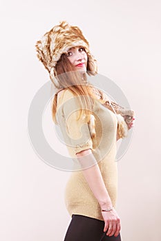 Winter woman in warm clothing fur cap