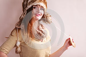 Winter woman in warm clothing fur cap