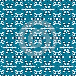Winter wonderland delicate white snowflake crystals on a teal blue snow textured background