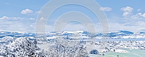 Winter wonderland and magical Christmas landscape. Snowy mountains and forest covered with snow as holiday background