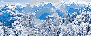 Winter wonderland and magical Christmas landscape. Snowy mountains and forest covered with snow as holiday background