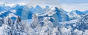 Winter wonderland and magical Christmas landscape. Snowy mountains and forest covered with snow as holiday background