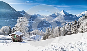 Winter wonderland with mountain chalet in the Alps