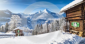 Winter wonderland with mountain chalets in the Alps