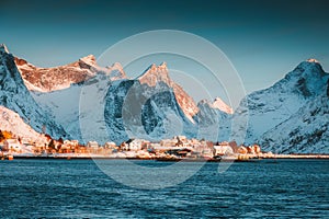 Winter wonderland of Reine town fishing village with fjord mountain in the morning at Lofoten Islands