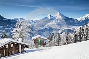 Winter wonderland scenery in the Alps with traditional mountain chalets