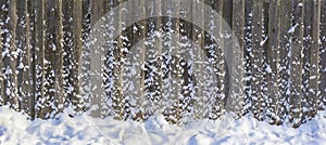 Winter wooden fence with snow. Christmas texture. New Year`s collection. Great for background for New Year and Christmas design.