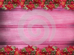 Winter wooden rose pink red cherry nature background with poinsettia two sides. Texture of painted wood horizontal boards.