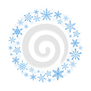 Winter wreath of blue snowflakes on white background