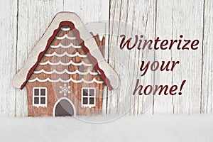 Winterize your home with winter house on weathered wood