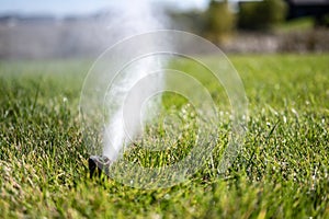 winterizing a irrigation sprinkler system by blowing pressurized air through to clear out water