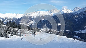 A winterlandscape in Tirol with active skiers