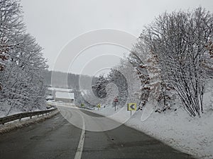 Winterscape road view from a car photo