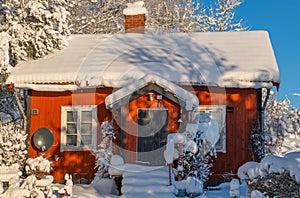 Wintry landscape with barn and house