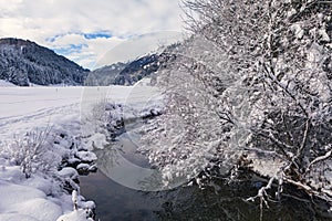 Wintry river in the alps