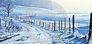 Wintry road in countryside photo