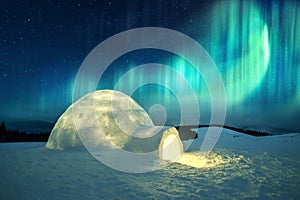 Wintry scene with glowing polar lights and snowy igloo