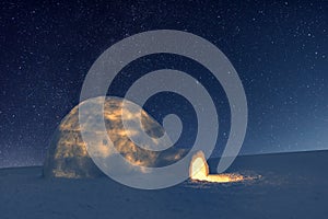 Wintry scene with resl snow igloo and milky way