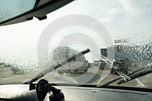 Wiper cleaning windshield