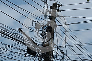Wire around electric ploe in Thailand.
