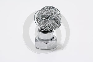 Wire ball in balance on metal