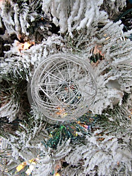 Wire ball hanging on Christmas tree