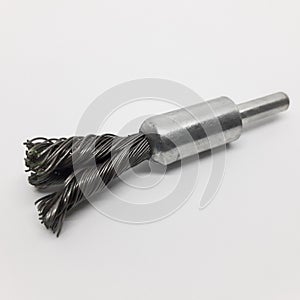 Wire brush for mechanical cleaning of metal on white background