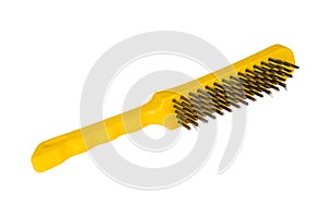 Wire brush on a white background. Metal brush with a yellow handle.