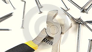 Wire cutters with yellow, gray handle on white