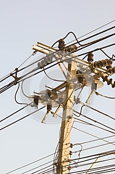 Wire on electrictity post on sky background