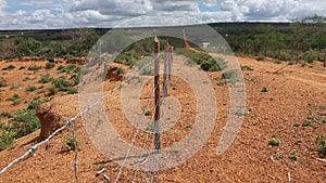 fence dividing properties in a rural area of the semi-arid region photo