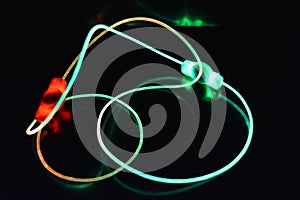 Wire with green and red light, a light guide wire with different light transmission, light spectrum, and light effects located in