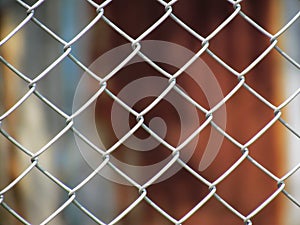 Wire Mesh fence with old zinc background