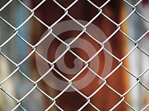 Wire Mesh fence with old zinc background