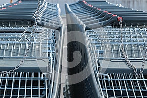 Wire modern supermarket shopping cart, symbol of consumerism