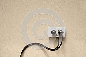 Wire plug Receptacle on the concrete wall background